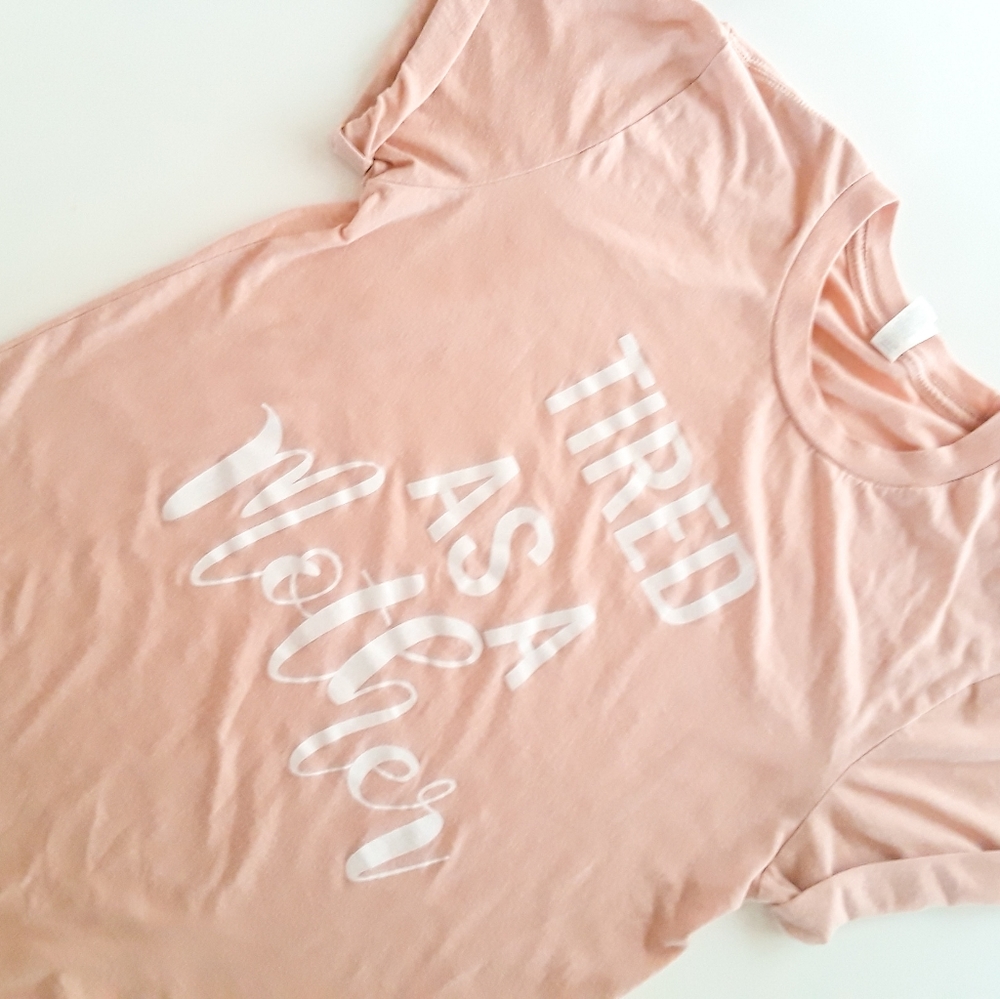 Blush pink graphic slogan tee "Tired As A Mother"